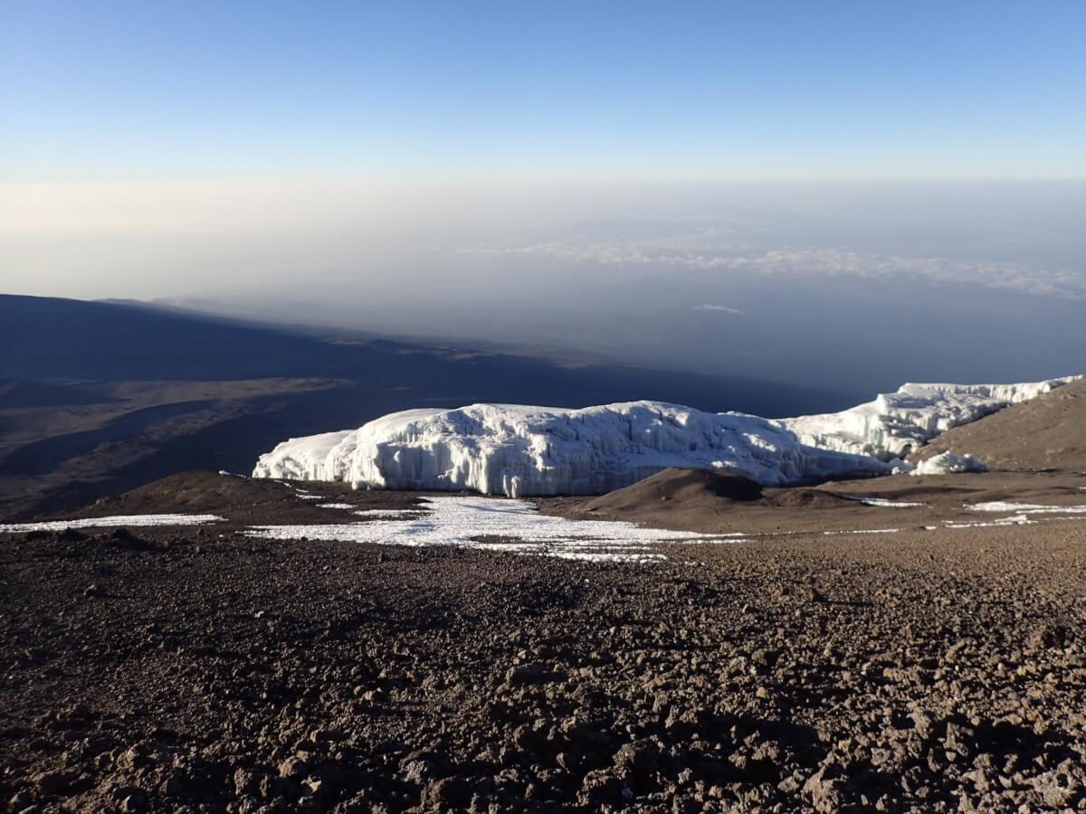 Sitting on top of a snow-less Kilimanjaro